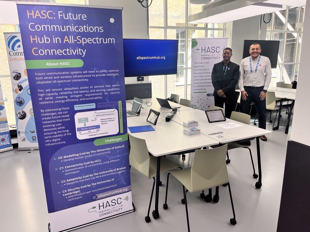 Anthony & Abderrahmen Standing by our Exhibition Banners at DySPAN 2025