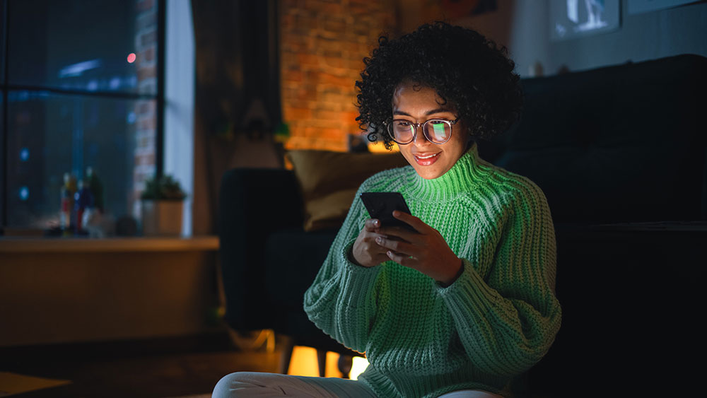 Young woman browses on her mobile device mmWave and THz Understanding the Differences