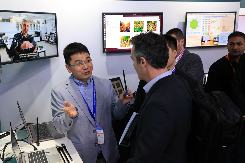 Junqing Zhang discusses Radio Frequency Fingerprint Identification (RFFI) with Kevin Adams OBE, Department for Science, Innovation and Technology (DSIT) at MWC 2026